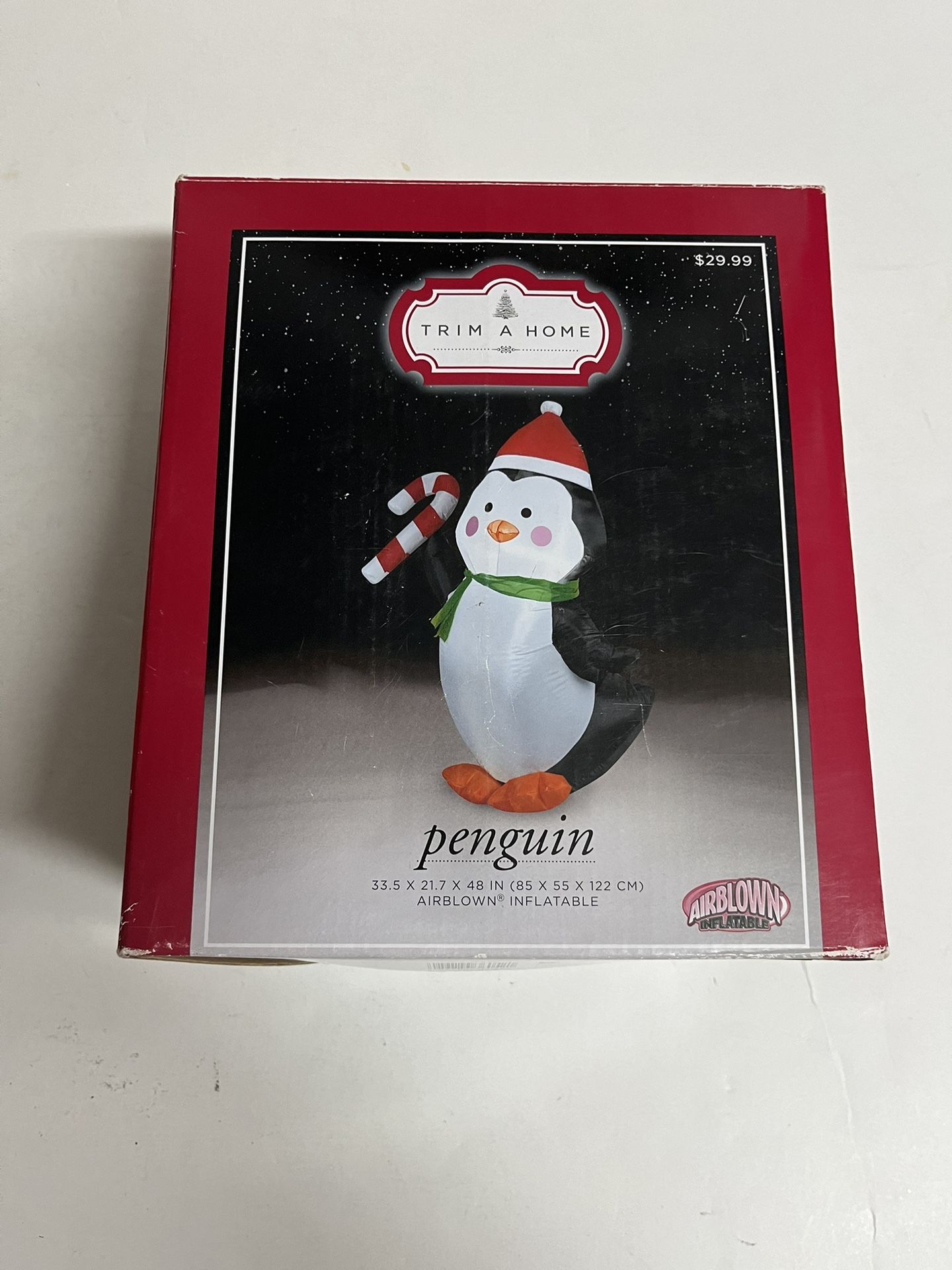 Christmas 4 foot tall lighted, inflatable, penguin holding candy cane