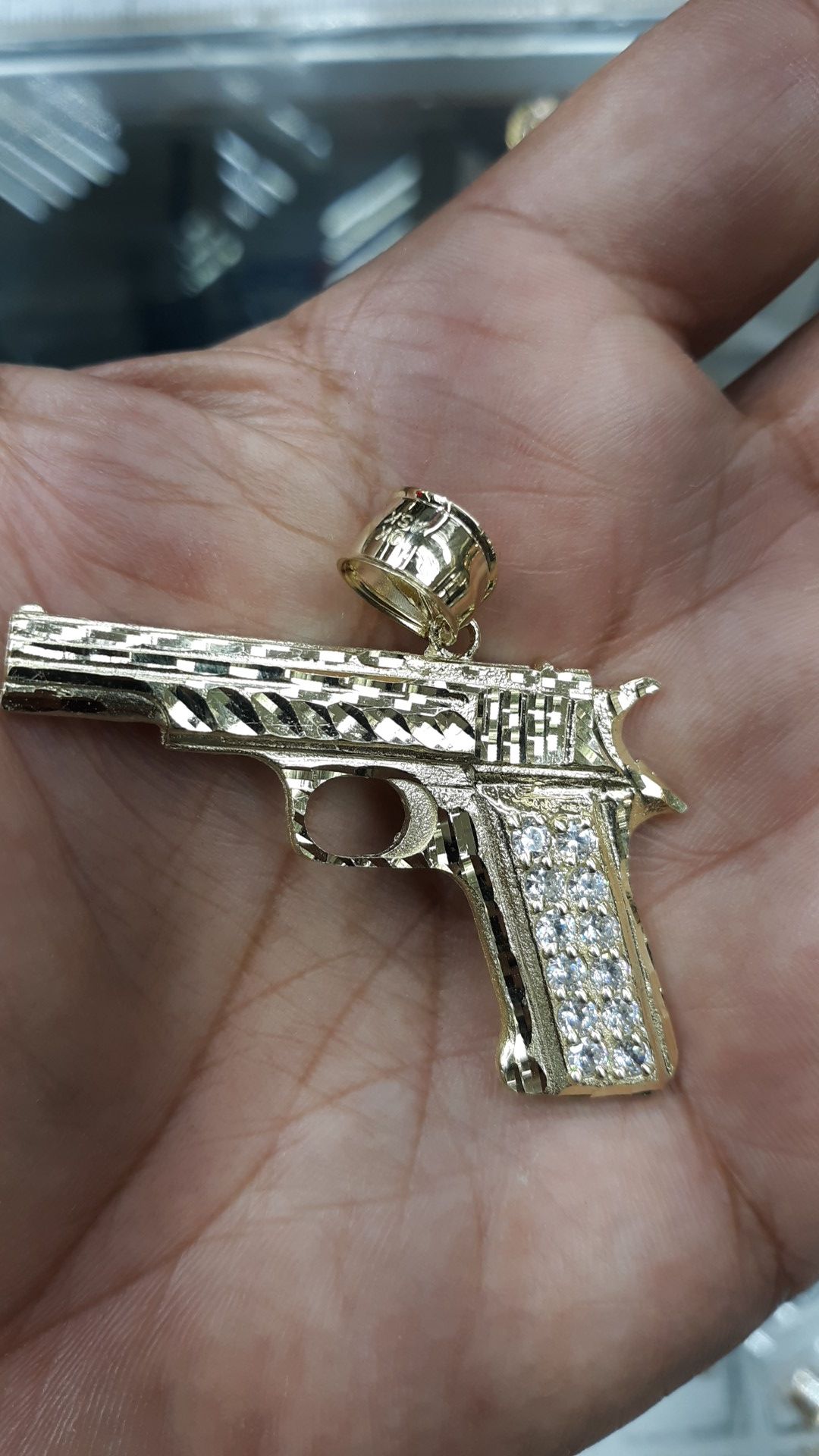 10k gold gun charm cz stones 12.2 grams 2 inch long 12.2 grams