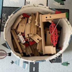 Basket Full Of Wooden Train Tracks With Trains