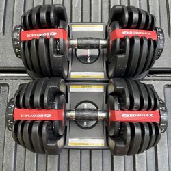 PAIR  OF  ADJUSTABLE  BOWFLEX  DUMBBELLS  :  EACH  ONES  GOES  UP TO  55 LBS.  =  105  LBS.  TOTAL 