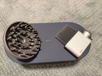 Authentic Dyson Airwrap Multi-Styler Complete Long in Nickel/Copper with deep navy / black storage case.