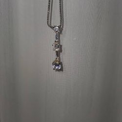 Past present and future pendant with baguettes in between 