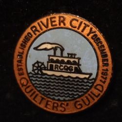 1977 December River City Quilter's Guild Boat Vintage Collectible Pinback Lapel Pin 1986