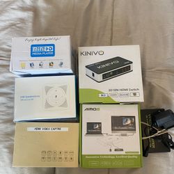 assorted HDMI switches and video capture devices