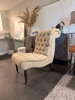 tufted accent chair in a neutral beige linen