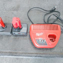 Two M12 6.0 Batterys With Charger All In Working Condition