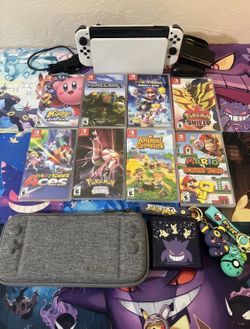 Nintendo Switch OLED. x8 games. Complete system. Everything works perfectly.
