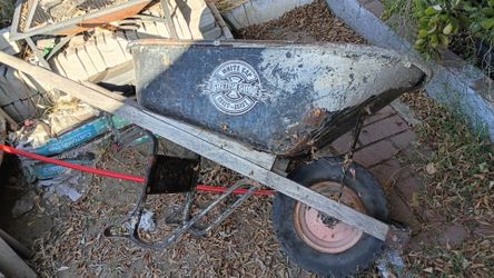 Wheel barrow black one have solid tire, blue need fix tire