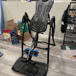 Teeter FitSpine LX9 Inversion Table, Deluxe Easy-Reach Ankle Lock, Decompression Surface for Back Pain Relief, Integrated Accessories, UL Safety Certi