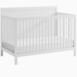 The Essentials Collection by Oxford Baby in White features a 4-in-1 Convertible Crib