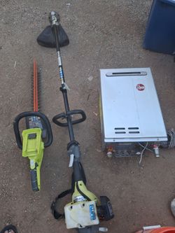 A boiler and weed eater and hedge sweep