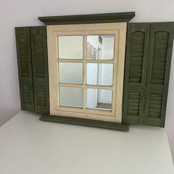 Vintage mirror 25 inches tall  22 inches long 3 inches wide