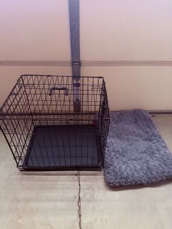 Great medium dog crate with a soft bed