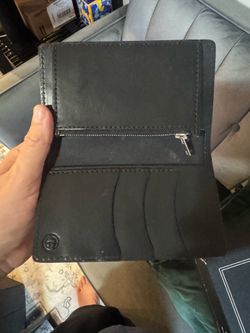 Travel wallet by tanner goods in black English bridal leather