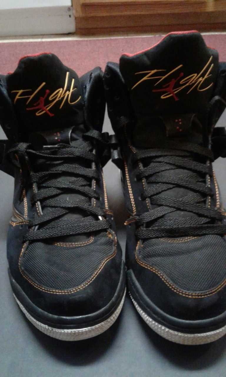 Black red and gold Nikes
