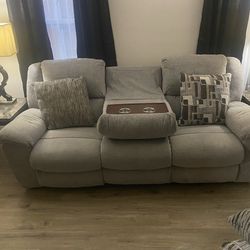 Gray , three seat recliner , not sure if size but I will say it average