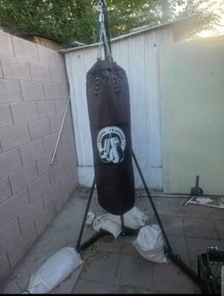 Lightly used punching bag/stand/sandbags