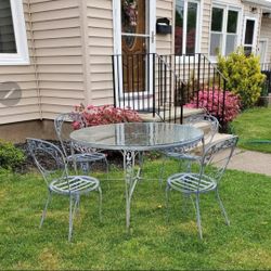 Vintage Heavy Wrought Iron Glass Top Patio Set.  