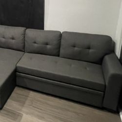 Sofa sectional with pull out bed and extra storage 