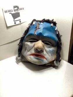 Frankenstein monster mask in a rare clown-style colorway with blue skin, black hair, and red lips.