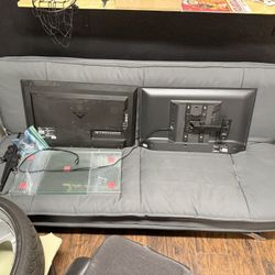 Futon And Two Small Tvs