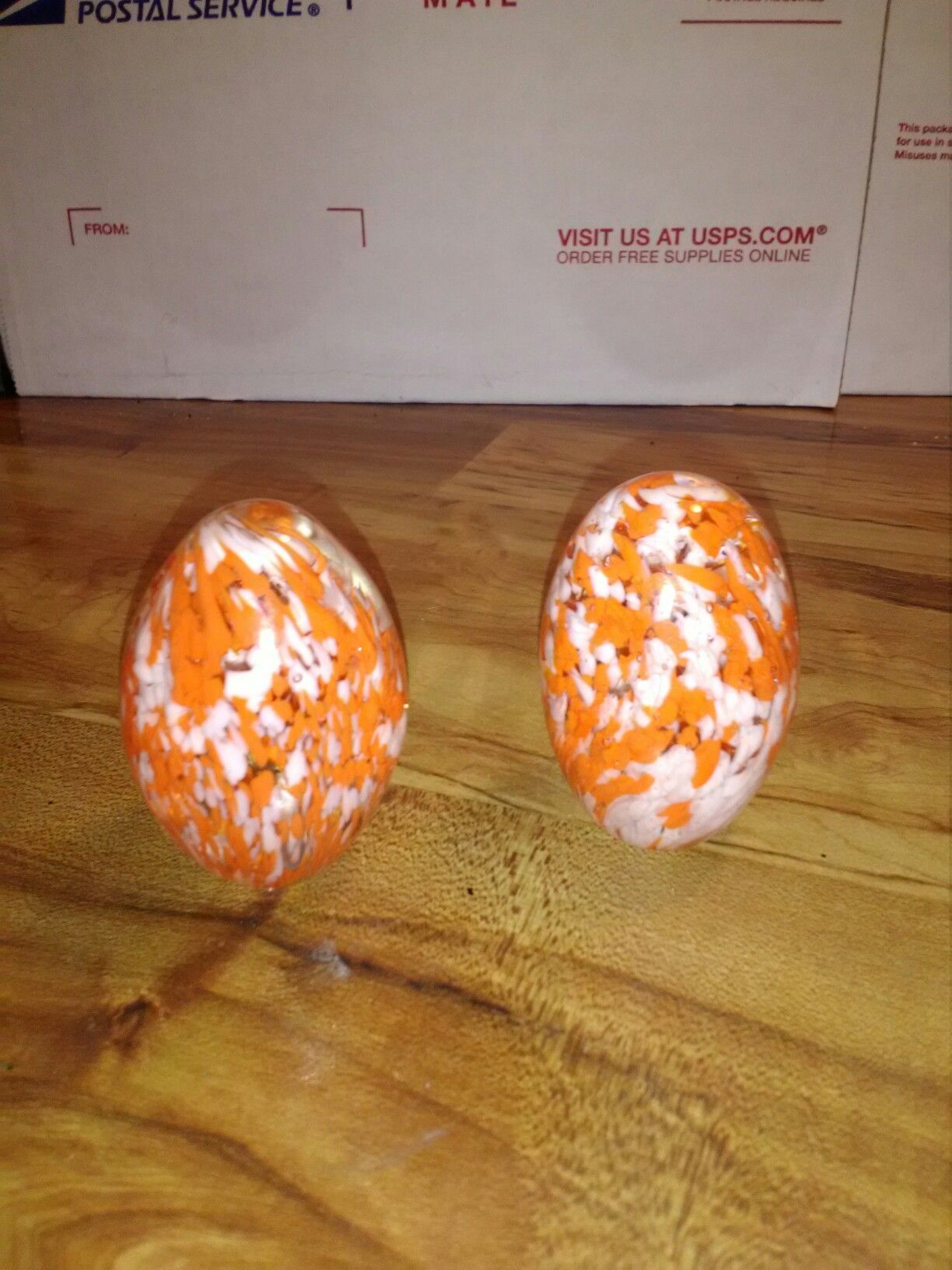 2 solid glass speckled orange egg paper weights