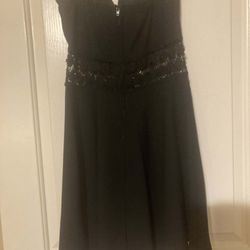 Cute black strapless with open mesh midriff. Size Junior medium.