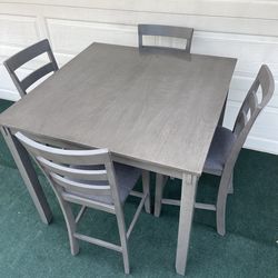 5-PC GRAY FINISH HIGH TOP DINING SET (TABLE AND 4 GRAY FABRIC PADDED CHAIRS)