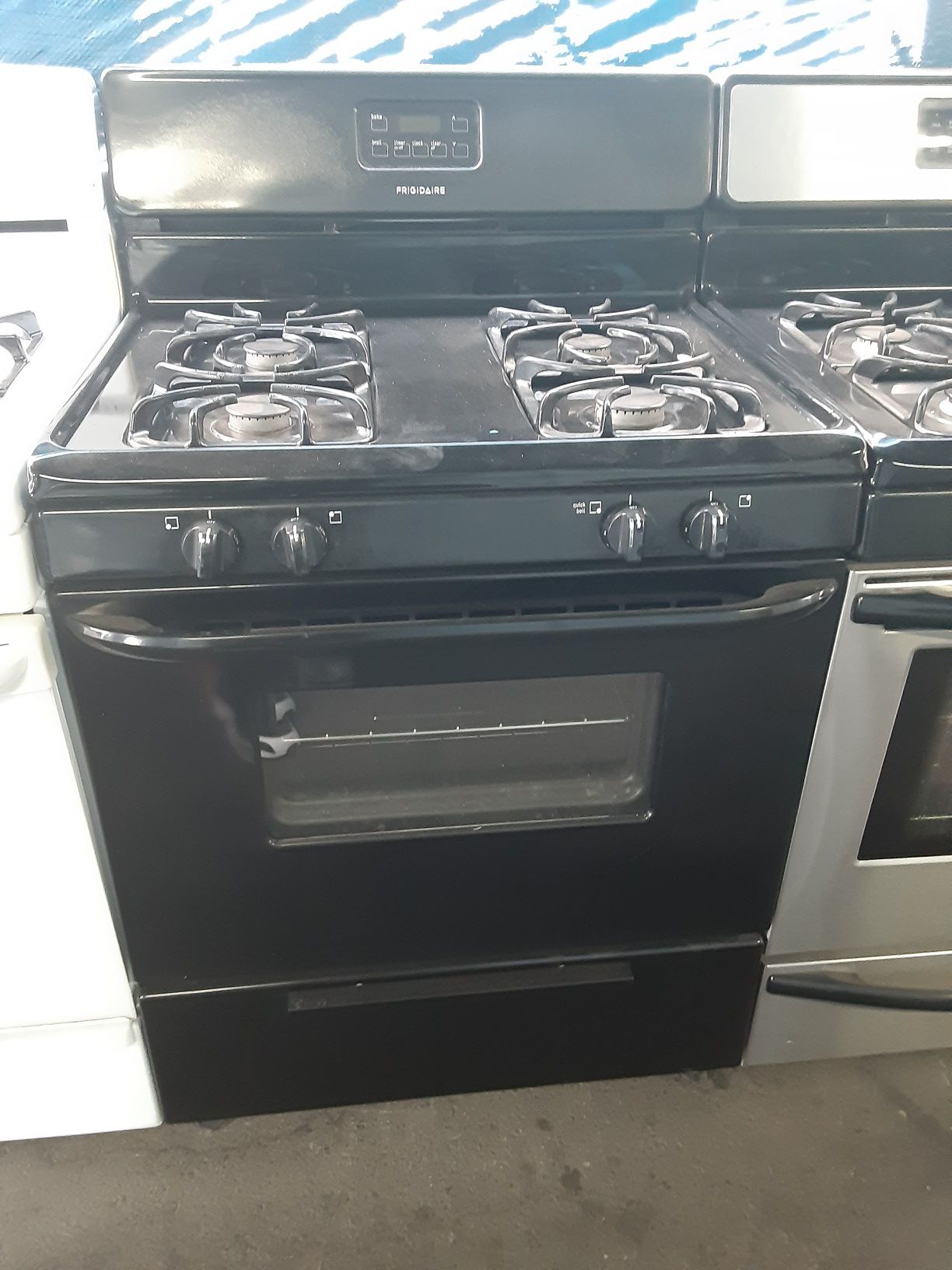 $299 Frigidaire black gas stove includes delivering the San Fernando Valley a warranty and installation