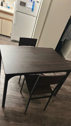 Dinner table with two chairs
