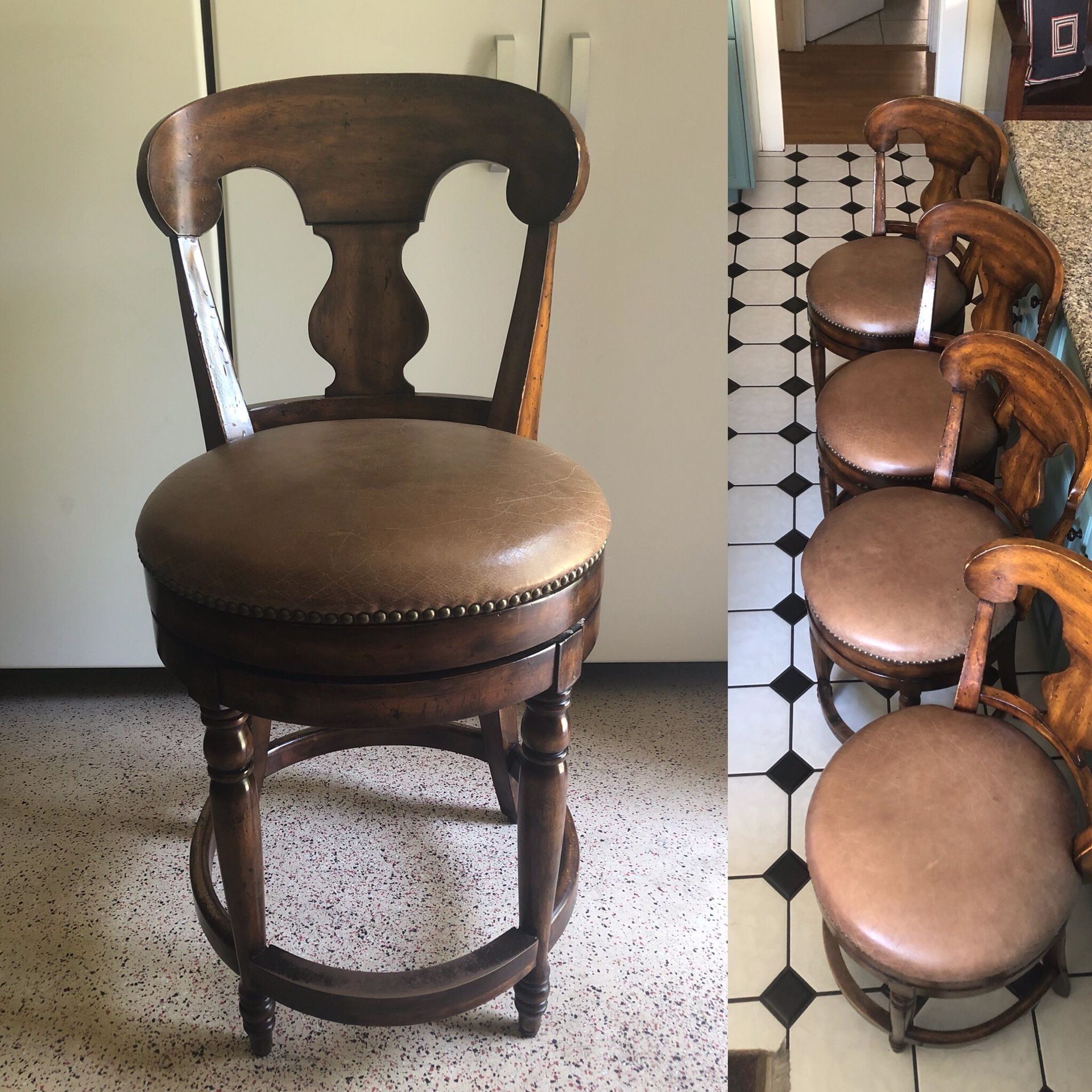 4 solid wood swivel bar stools w/ padded leather seats, nail trim, and a brass foot plate. for