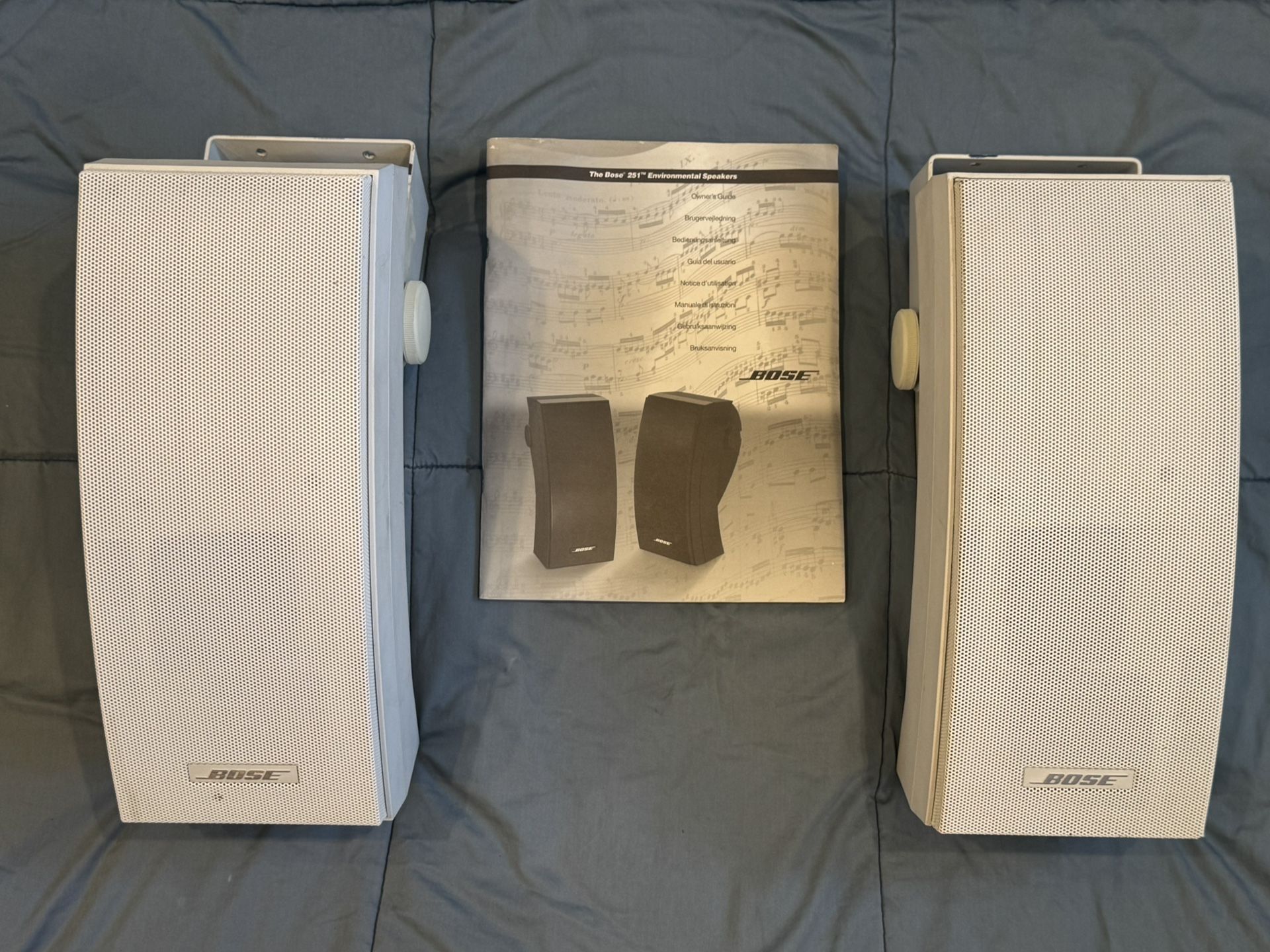 a pair of The BOSE 251 Environmental Speakers 