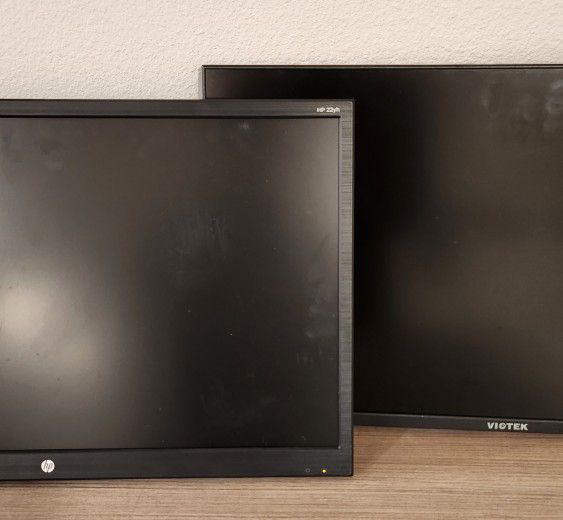 Two computer monitors HP and Viotek