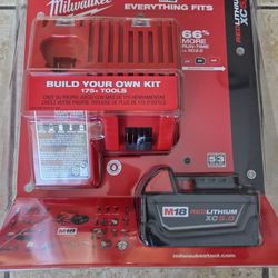 New Milwaukee  Charger And  XC 5.0 AH Battery.