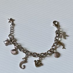 sterling silver sea shell charmed bracelet 