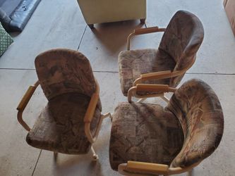 3 solid chairs on rollers