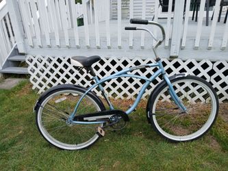 Huffy 26-inch beach cruiser bike with new chain and wide handlebars ready to ride