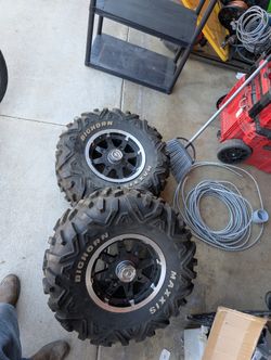 2 back tires and Rims 900 xp razer