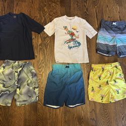 LOT of boys' size 10/12 swimming rash guards and shorts