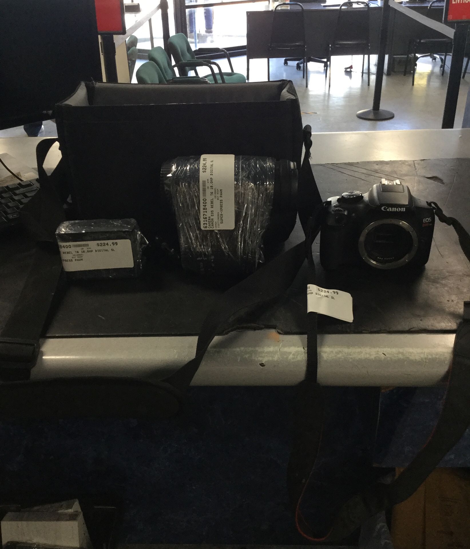 Canon eos rebel t6 ds126621 2 lenses (75-300mm) & (18-55mm) and charger with a carrying bag.