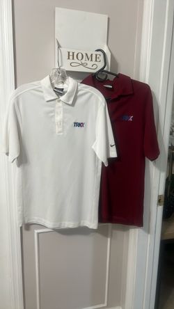 Two men’s TRKX by Nike  short sleeve shirts