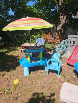 Price is firm. Children's waterfall water table with umbrella and free chair