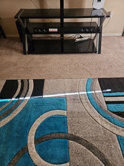 Glass Tv stand/swivel can hold 60"- 80" Tv