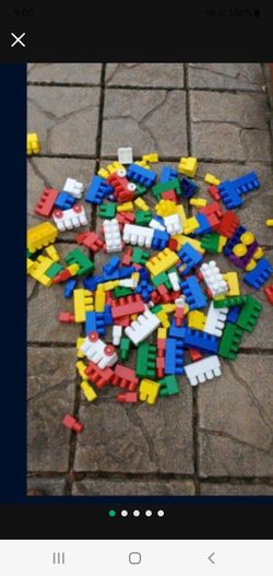 lego large type you can tell the size of blocks next to a water bottle 