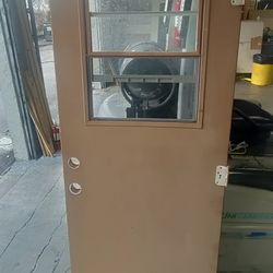 Exterior metal door with single hung window two bottom corners weathering slightly 32x79 C last photos