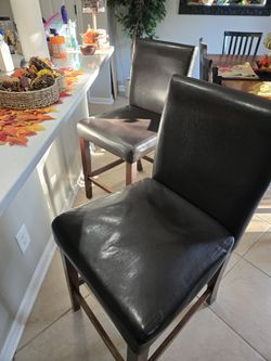 Two Brown Leather Bar Stools