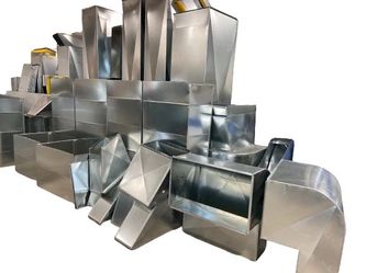 a/c ductwork fabrication. —— fabricacion de ductos para aire acondicionado