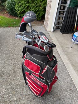 Assorted golf clubs and bag