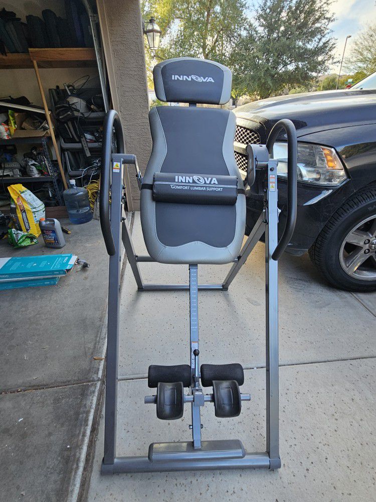 Used once- Innova Inversion Table with Adjustable Headrest, Reversible Ankle Holders, and 300 lb Weight Capacity.