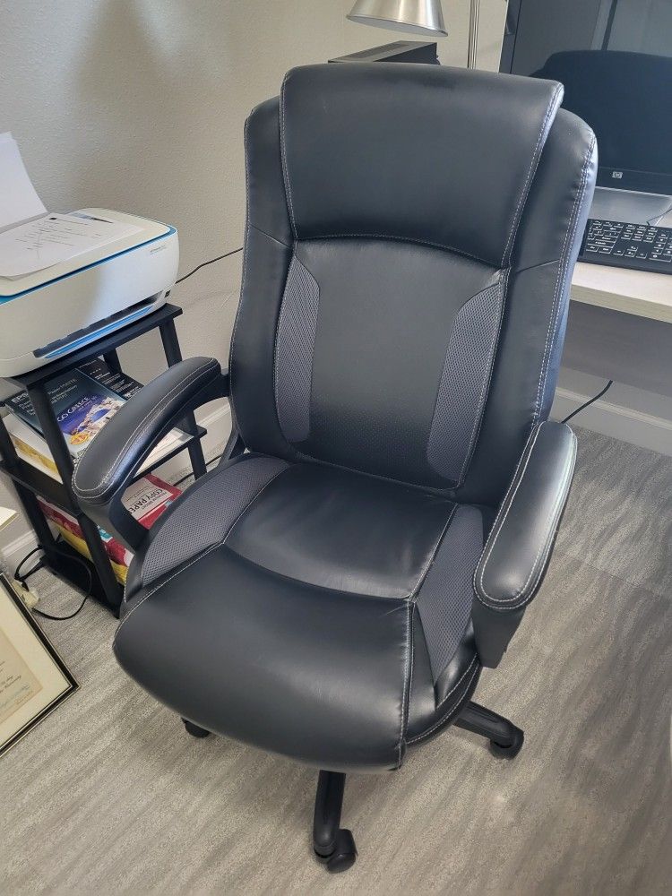 Office Chair: PLUSH BLACK LEATHER, SWIVEL, ADJUSTABLE HEIGHT, 8 MONTHS OLD, NO RIPS OR TEARS, SMOKE FREE HOME OFFICE, ON CASTERS, NO ISSUES